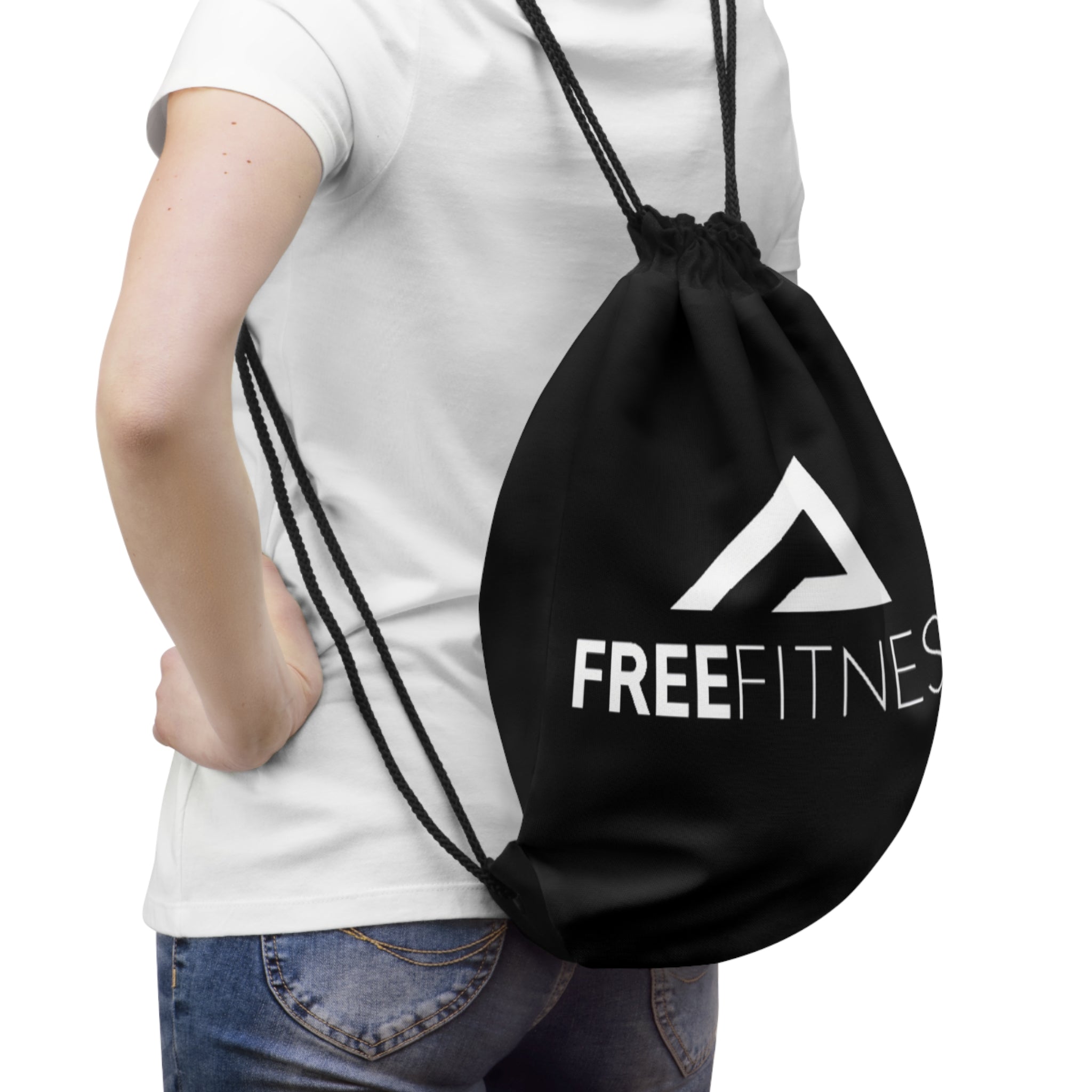 a woman carrying a gym bag with a freefittings logo on it